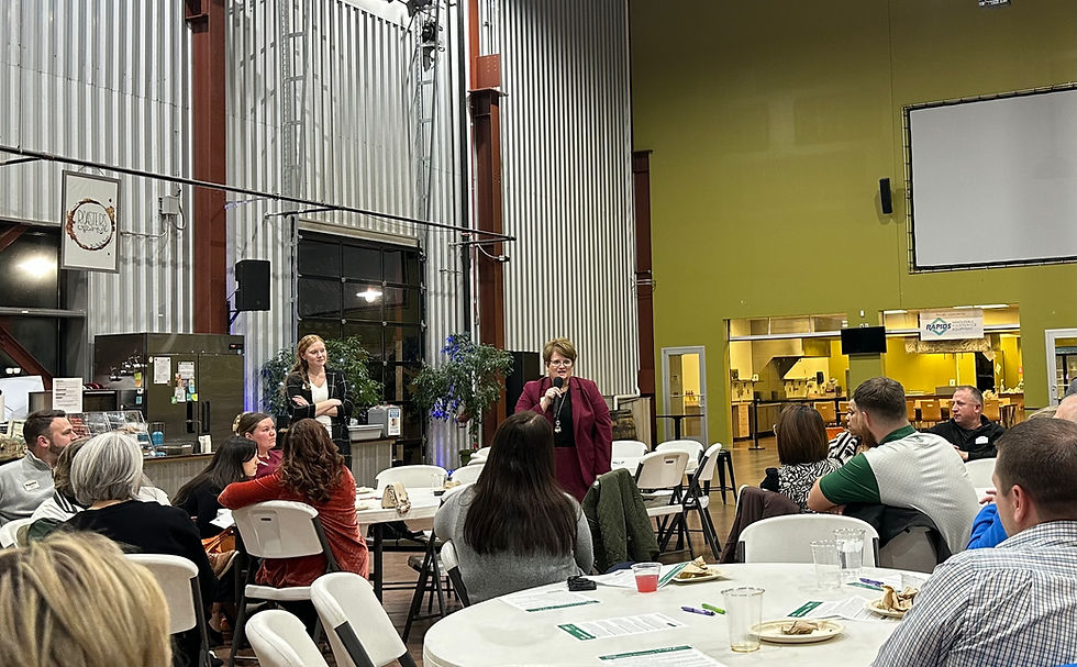 Legislator speaking to meeting attendees