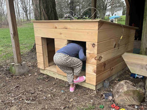 A cutting board, a doghouse and a vanity