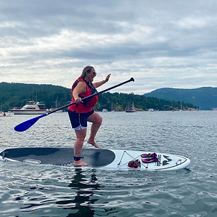 woman balancing on paddleboard.jpg