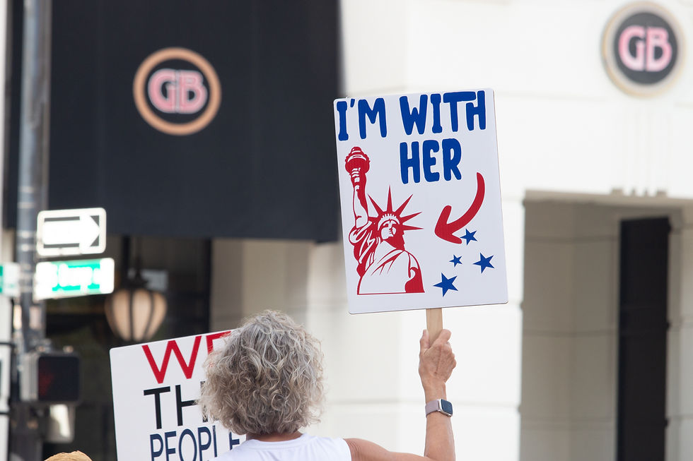 A protester brandishing a sign during a 50501 protest in Orlando, Florida.