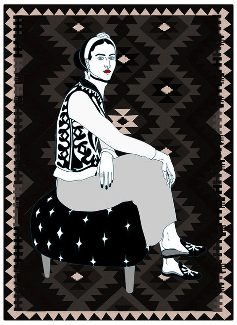 elegant woman sitting against ornate tapestry