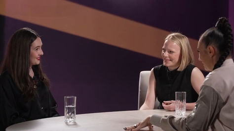 Three women sit at a roundtable discussion on a podcast.