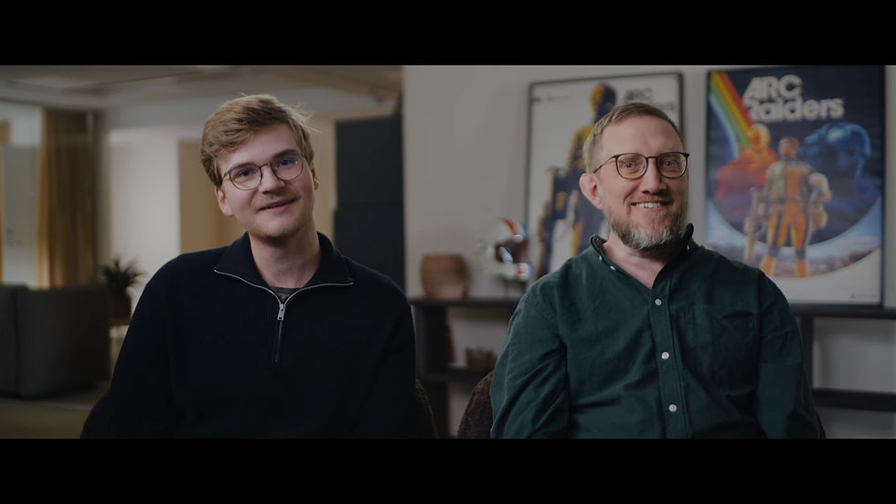 Two men in an interview setting.