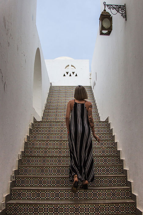 back-view-of-woman-in-dress-walking-on-stairs-at-r-2024-11-10-22-08-12-utc.jpg