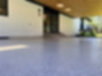 Full flake patio floor coating installed on a covered residential patio.