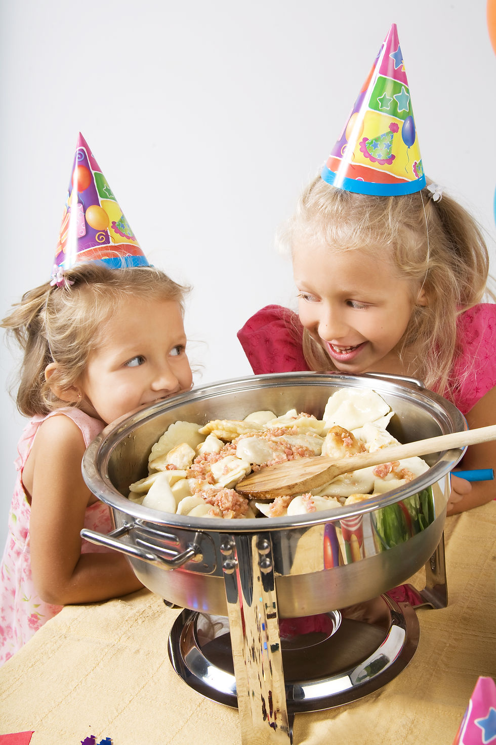 Kids having birthday party looking at a pot with Best Pierogi