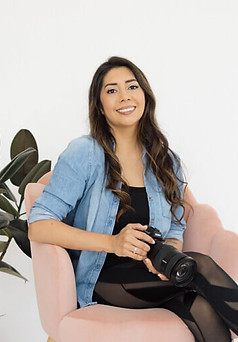 Vanessa, lead boudoir photographer at Popoca Boudoir in Wilmington NC, smiling in her studio