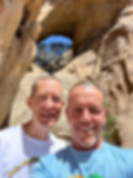 standing under Garretts Arch in Joshua Tree National Park