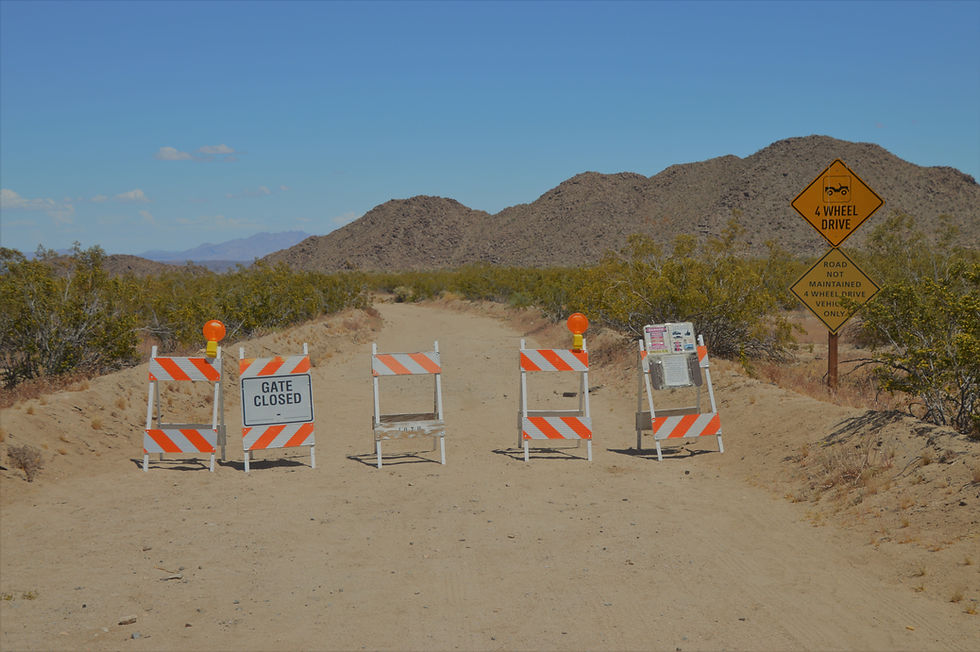 Traffic barriers at entrance to Black Eagle Mine Rd Trail Joshua Tree National Park
