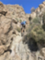 Scrambling up rock face in Swiss Canyon in Little San Bernardino mountains