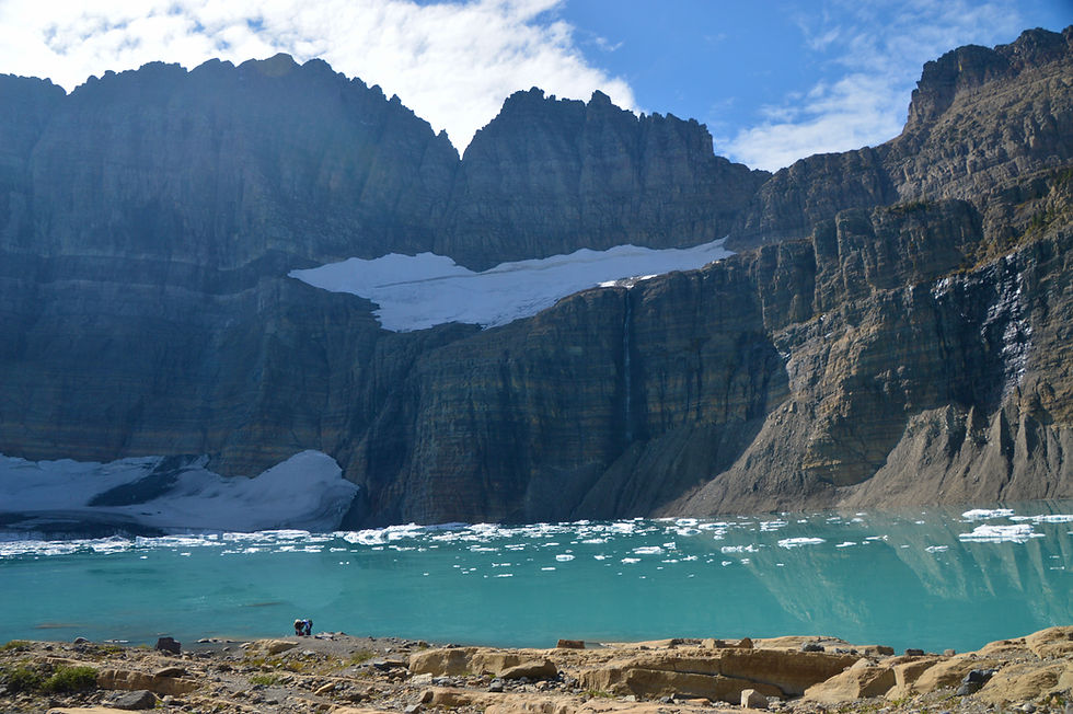 sheer cliffs rising above Grinnell Glacier Lake