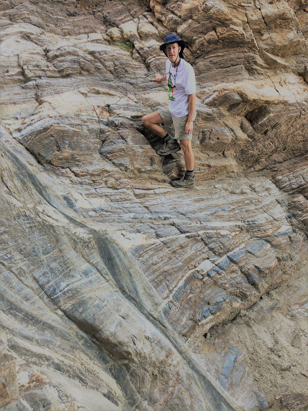 Scaling 30 foot rock ledge in Carrizzo Canyon in the Santa Rosa Mountains in Palm Desert CA