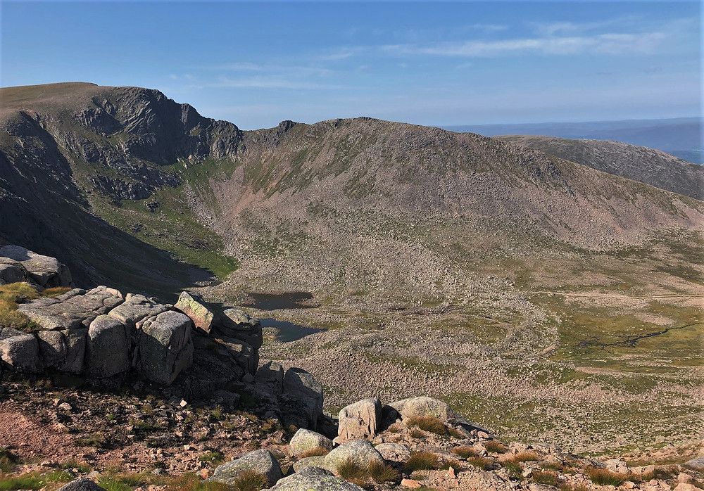 The Coire an t-Sneachda headwall with cliffs reaching 600 feet high. Fiacaill Coire an t-Sneachdaand is the ridge directly across the basin