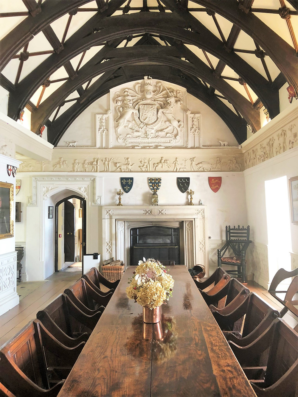 The Tudor Great Hall in St Michael's Mount castle. An oak table with monastic chairs makes for an imposing effect.