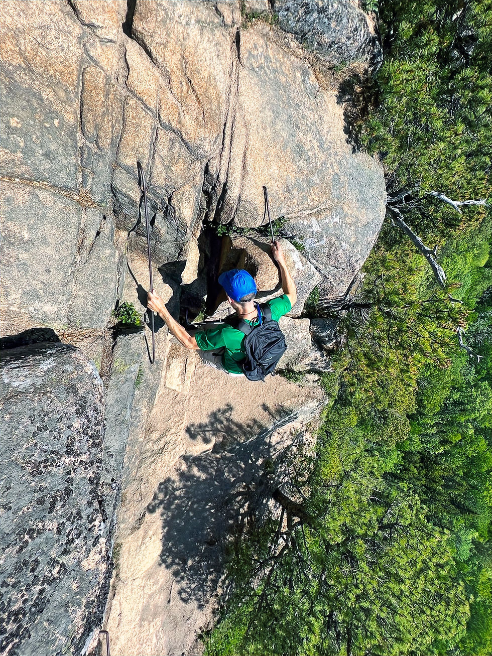 using iron rungs secured in the cliff face on the Beehive Trail in Acadia