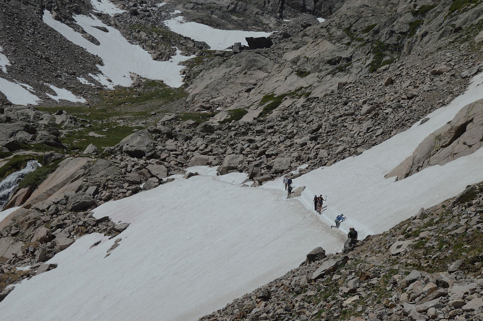 Crossing a snowfield on hike to Chasm Lake in Rocky Mountain National Park