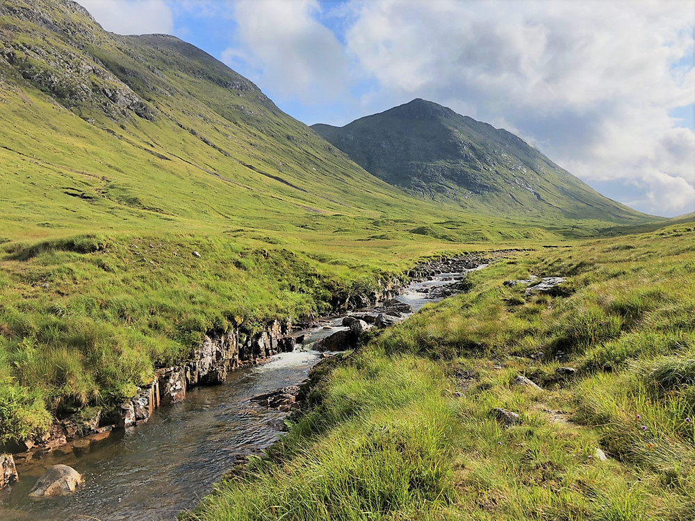 Walking along the Lairig Gartain pass in Etive Glen in Scottish Highlands