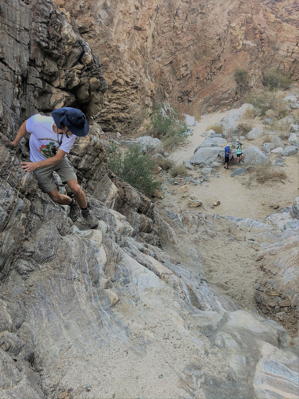 Scaling 30 foot rock ledge in Carrizzo Canyon in the Santa Rosa Mountains in Palm Desert CA