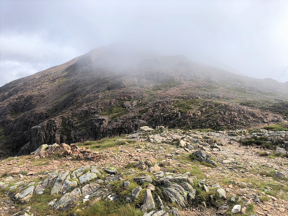 From the baelach the view of the summit of Stob Dearg Buachaille Etive Mòr in the Scottish Highlands was covered in clouds