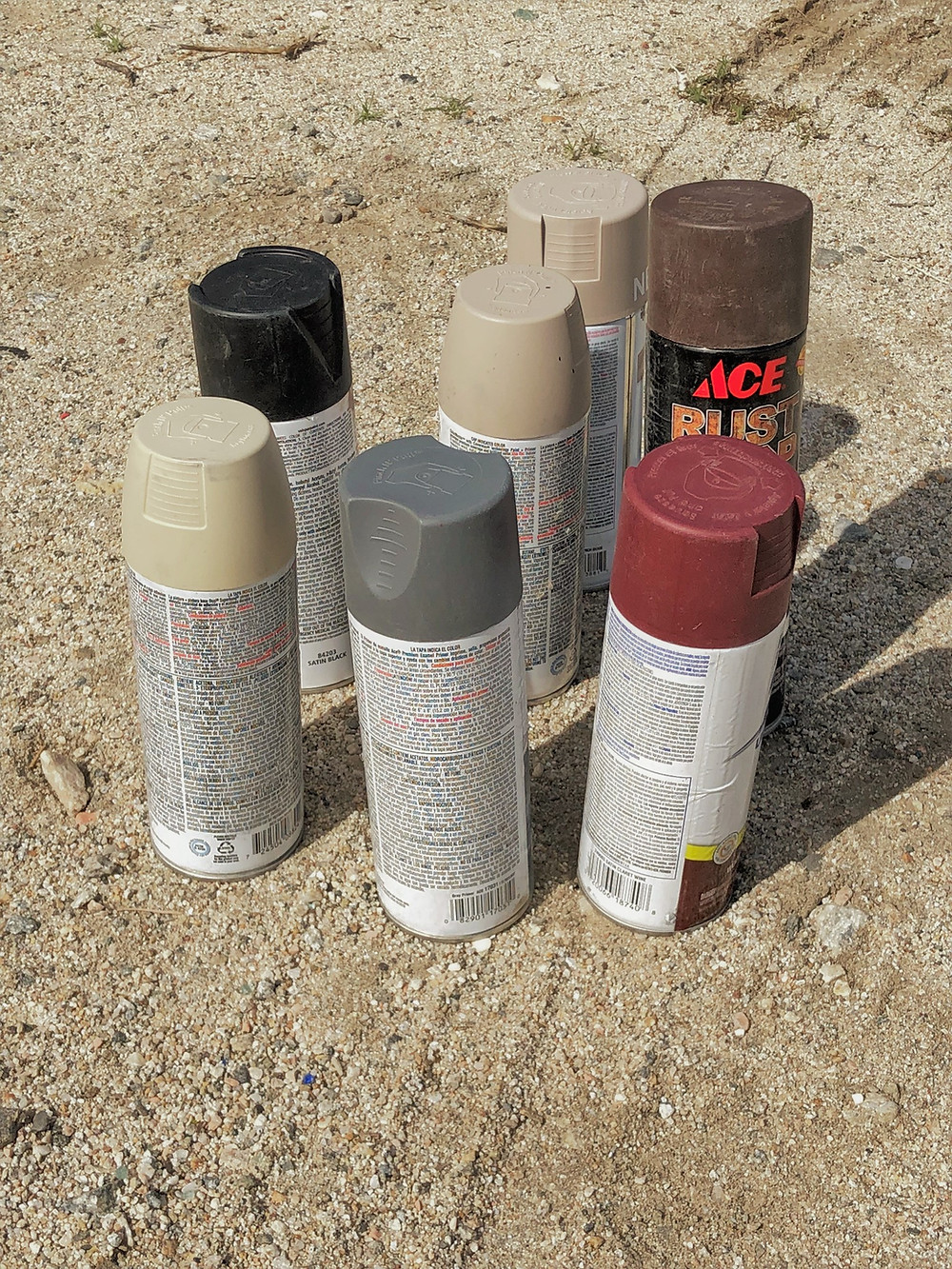 We use spray paint to cover over graffiti on rocks along hiking trails