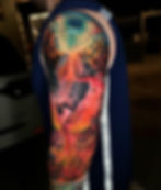 Colorful phoenix tattoo on an upper arm