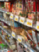 Shelf of Japanese instant ramen and dried noodle varieties at Nijiya Market in San Francisco Japantown.