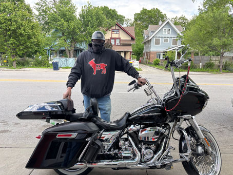Troost39 customer Steve with his Harley-Davidson motorcycle parked outside the store