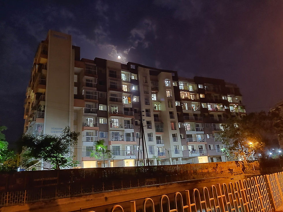 Victory Heights residential building at night