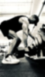 A man doing a heavy dumbbell row