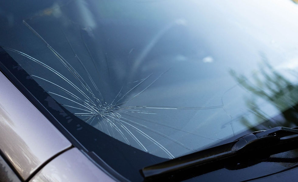 Cracked car vējstikls with spiderweb damage pattern