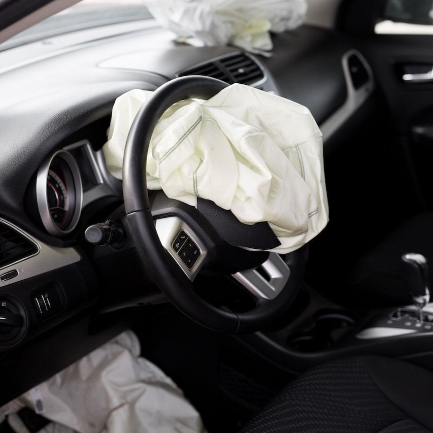 Deployed car airbag in steering wheel