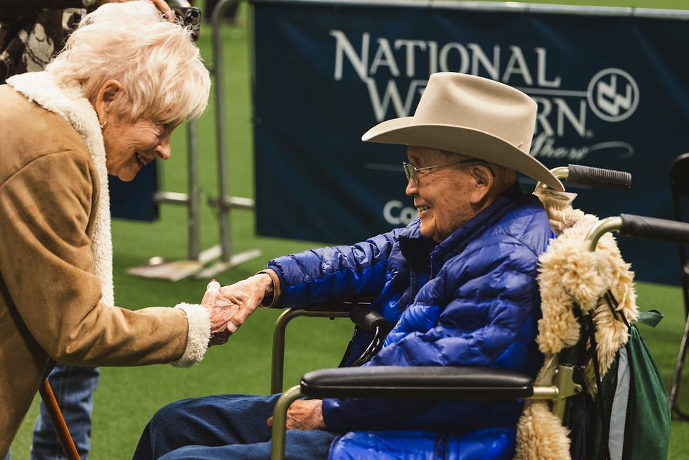 Sue Anschutz-Rodgers and Dr. John Matsushima at the Catch a Calf show. Photo by Liz Munsterteiger