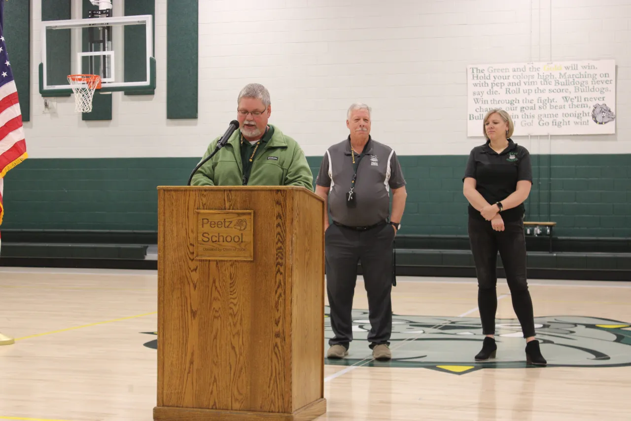 Brian Kurz, social studies teacher and student council sponsor, speaking on behalf of students, than