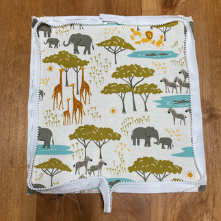 zipper has been hand basted to edges of sewing project