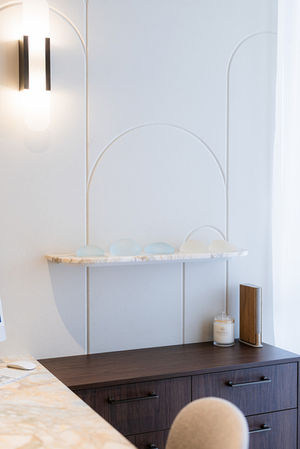 Minimalist floating stone display shelf to plastic surgeons office.