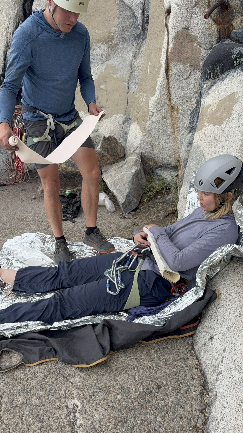 MTN participants practice patient care beside a granite crag