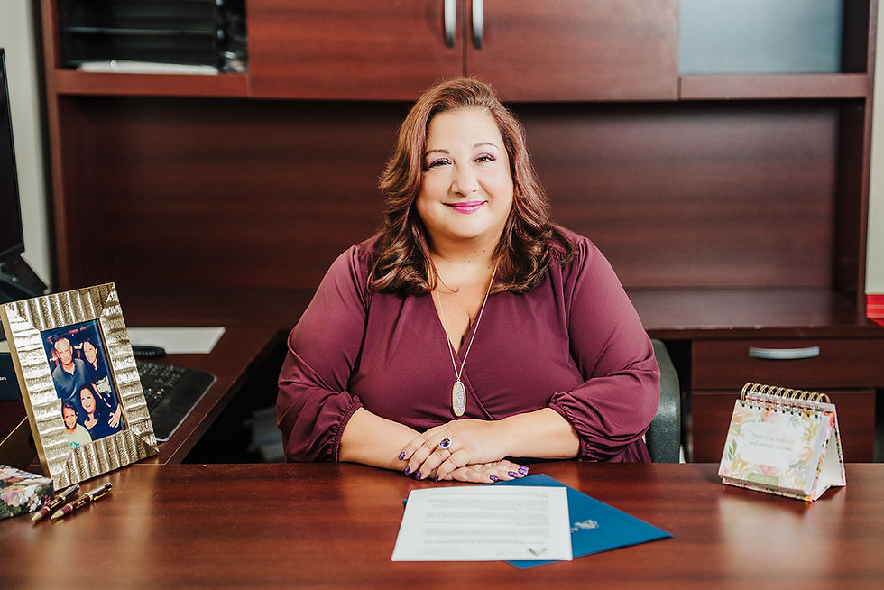 Attorney Amy Azza at desk working on a will