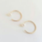 Thumbnail: Pearl Huggie Earrings. 14K goldfill pearl huggie hoops. 