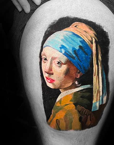 Realistic color tattoo of a girl with a pearl earring