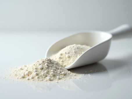 Close-up view of a scoop filled with True Code Creatine HCL supplement