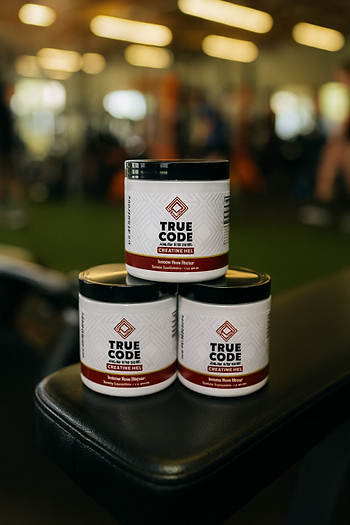 True Code Creatine HCL on a workout bench