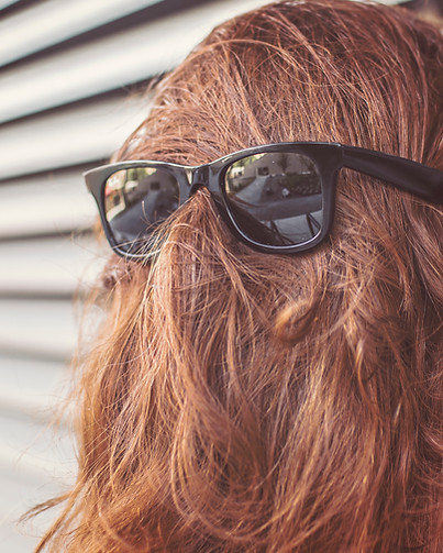Faceless person with glasses