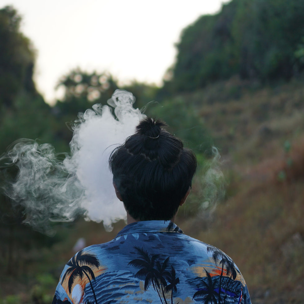 rear-view-man-smoking-outdoors.jpg