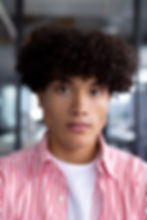 modern-office-biracial-young-male-wearing-striped-shirt-standing.jpg