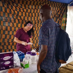 Volunteer Jamie Orr working as pharmacy tech during Togo 2016 Medical Mission