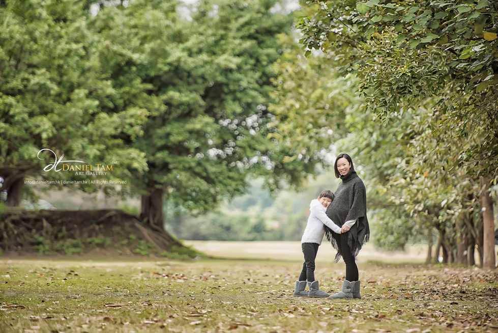 pregnant woman and daughter in the forest