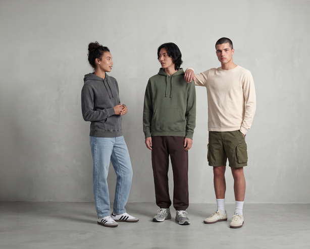 OneShot generated a fashion editorail campaign. 3 models stood in front of the clean concrete wall and soft lighting