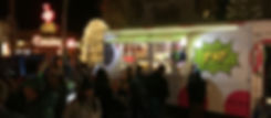The Kernel, Jackson Hole POP's popdorn food truck at Rendezvous Festival's concert with the Million Dollar Cowboy Bar and Antler Arches in the background