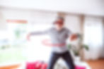 Elderly man with baseball cap and sunglasses using a hula hoop
