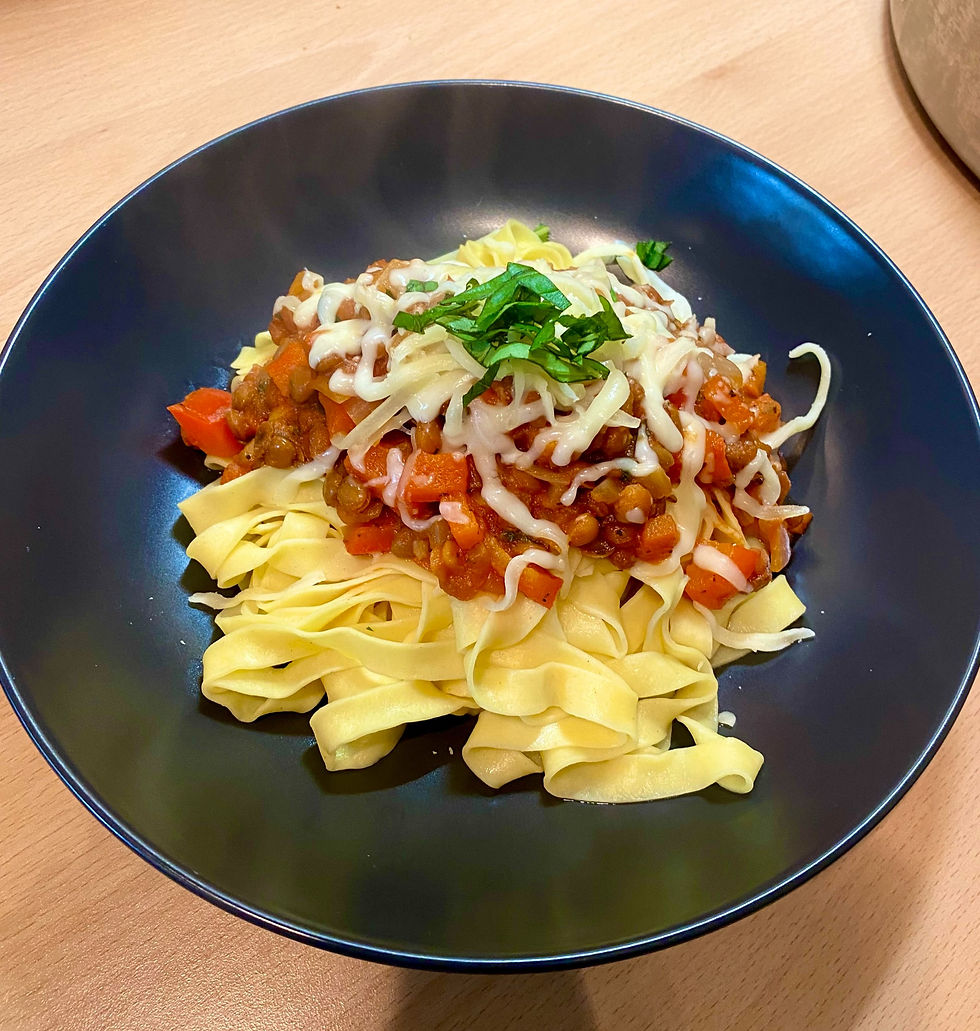 bolognese served with fresh pasta and topped with cheese